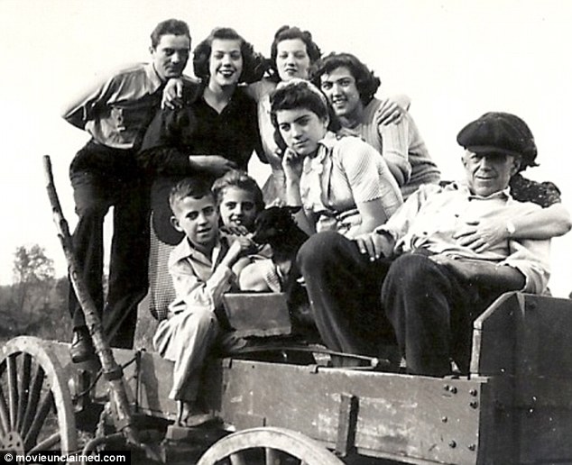 Younger years: Jean and her younger brother are pictured center while growing up in Alabama